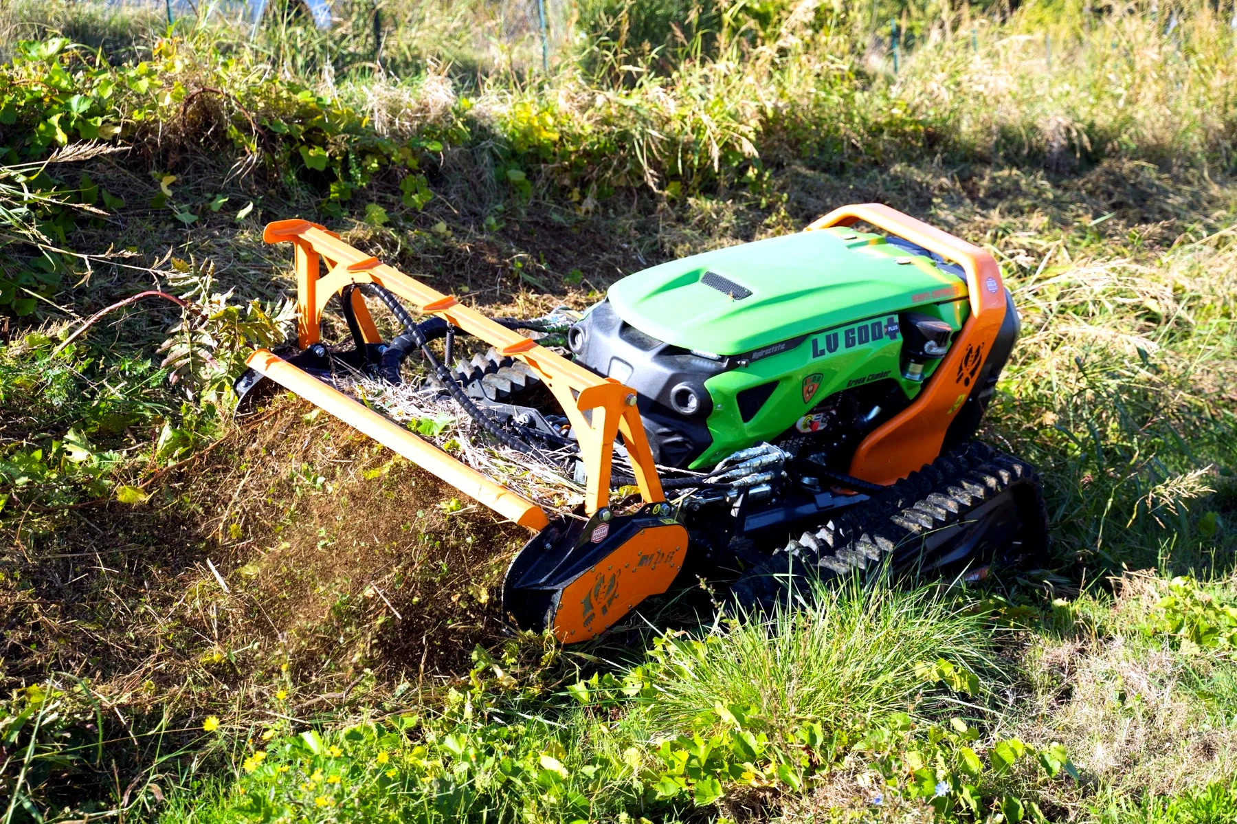 Remote-controlled Green Climber working on steep vegetation